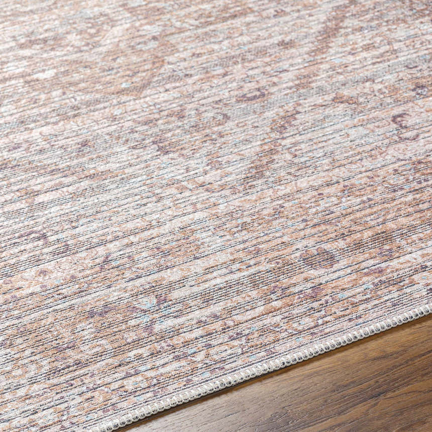 Close-up of Elisa Area Rug showing its traditional pattern, lambswool, brown, and light gray colors. Machine woven texture. Texture