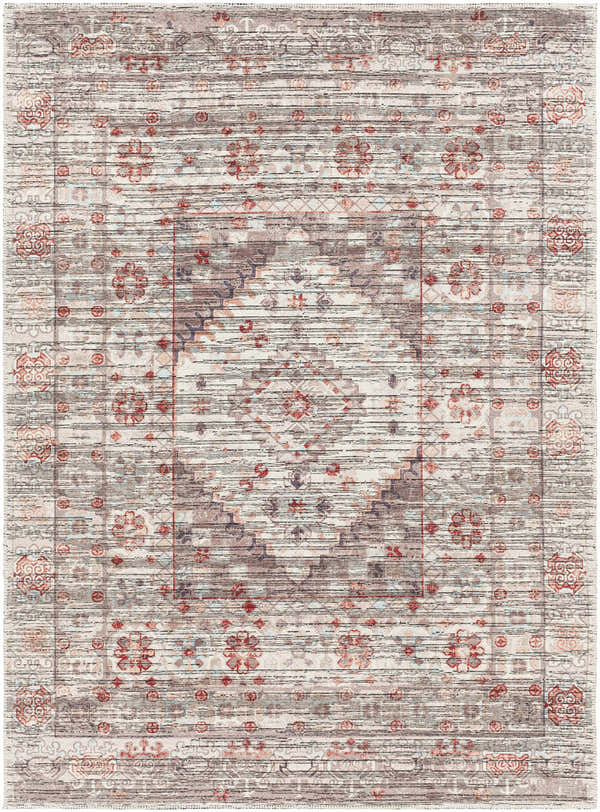 Close-up of the Liam Area Rug in Beachhouse, showing its traditional floral pattern and distressed texture. Design-Rectangle-57