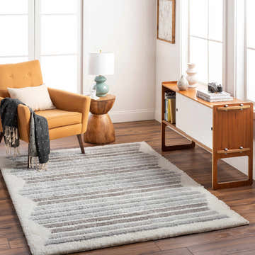 Living room scene with a Buono Rose Cream Area Rug, mustard chair, and mid-century modern console table. Roomscene-Rectangle