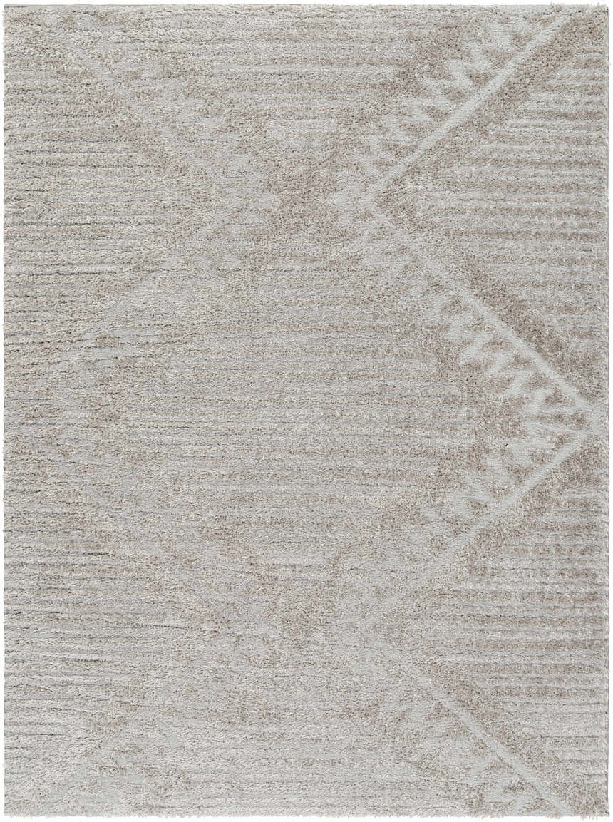 Close-up of the Edsel Gray Area Rug showing its shag texture and subtle geometric pattern in shades of gray and taupe. Design-Rectangle-537