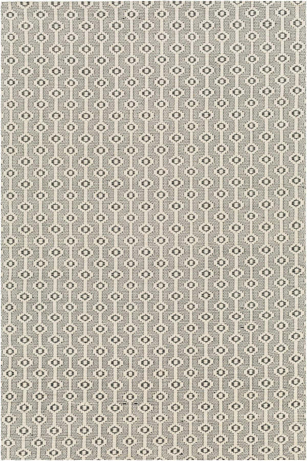 Close-up of Puna Area Rug showing a black and bone geometric trellis pattern. Hand woven texture. Design-Rectangle-576