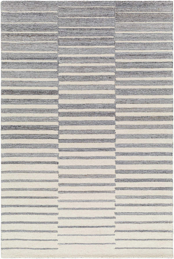 Close-up of the Gawel Gray Area Rug, featuring a contemporary striped pattern in charcoal, light gray, and cream. Hand-tufted wool texture. Design-Rectangle-576