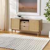 Living room scene with a light wood console table and the Gawel Gray Area Rug. Roomscene-Rectangle