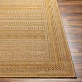Close-up of the Freja Flatweave Faux Jute Rug showing beige, camel, and brown tones with a subtle geometric pattern. Front