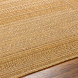 Close-up of the Freja Flatweave Faux Jute Rug showing beige, camel, and light brown woven texture. Texture