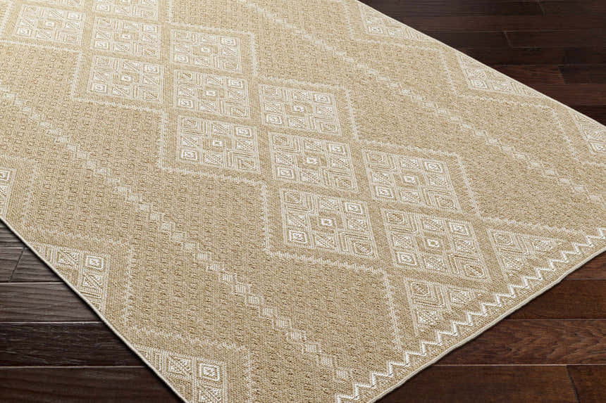 Close up of the Olina Flatweave Faux Jute Rug showing khaki and tan geometric pattern and texture. Corner