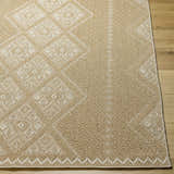 Close-up of the Olina Flatweave Faux Jute Rug. Khaki and tan rug with a geometric diamond pattern and textured weave. Front