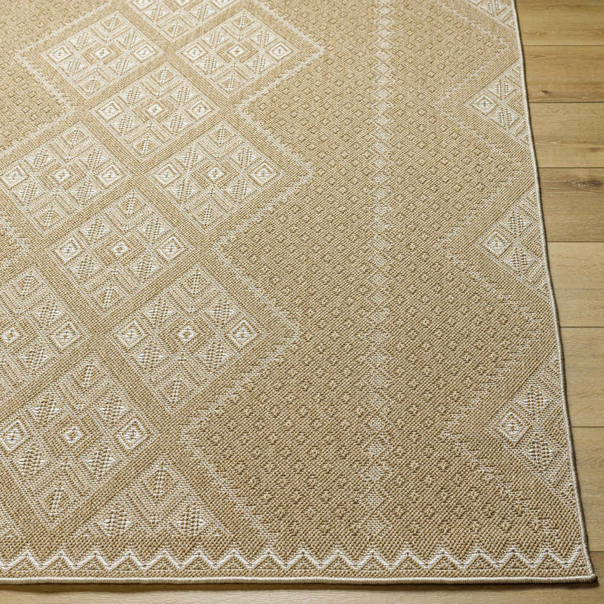 Close-up of the Olina Flatweave Faux Jute Rug. Khaki and tan rug with a geometric diamond pattern and textured weave. Front