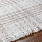 Close-up of the Inara Light Brown Plaid Hand Woven Area Rug showing beige, brown plaid pattern and fringe detail. Texture
