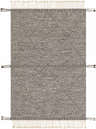 Close-up of Spottswood Area Rug. Black and cream cotton rug with a diamond pattern and fringe. Bohemian farmhouse style. Design-Rectangle-576