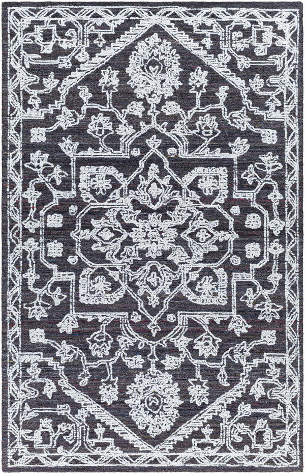 Close-up of the Black Derya Area Rug. Charcoal rug with light gray, traditional floral and geometric pattern. Design-Rectangle-576