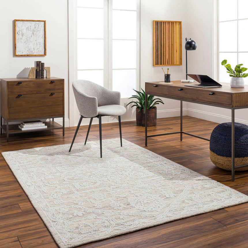 Bright home office with a White Derya Area Rug, wood desk, gray chair, and dark wood floors. Roomscene-Rectangle