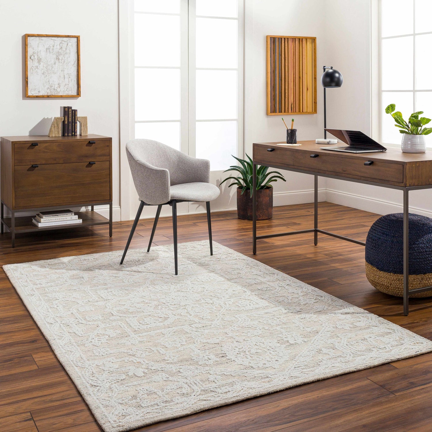 Bright home office with a White Derya Area Rug, wood desk, gray chair, and dark wood floors. Roomscene-Rectangle