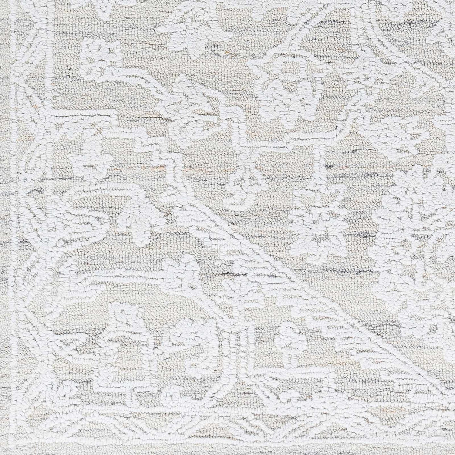 Close-up of the White Derya Area Rug showing its hand-tufted texture and farmhouse-style gray and white traditional pattern. Swatch