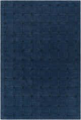 Close-up of the Sanvi Navy Wool Area Rug, featuring a contemporary grid pattern in navy and black. Hand-tufted texture. Design-Rectangle-576