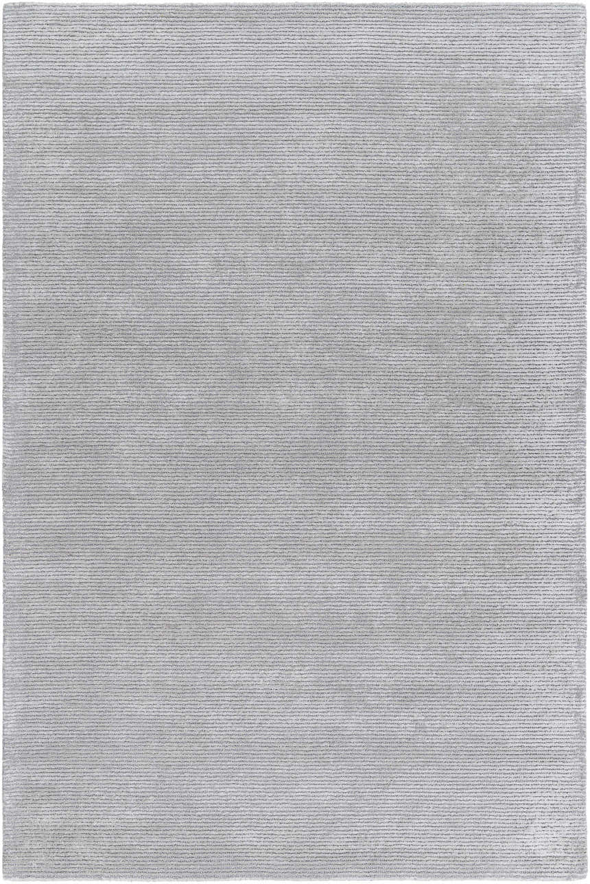 Close-up of the hand-tufted Noham Area Rug in metallic silver, pale slate, and silver gray. Contemporary style. Design-Rectangle-576