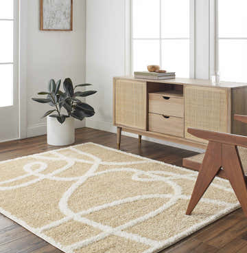 Living room scene with Gilon Camel Plush Area Rug, wood floors, and mid-century modern furniture. Roomscene-Rectangle