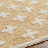 Close-up of the Satu Beige Area Rug, a shag rug with a geometric Moroccan design and soft, plush texture. Texture
