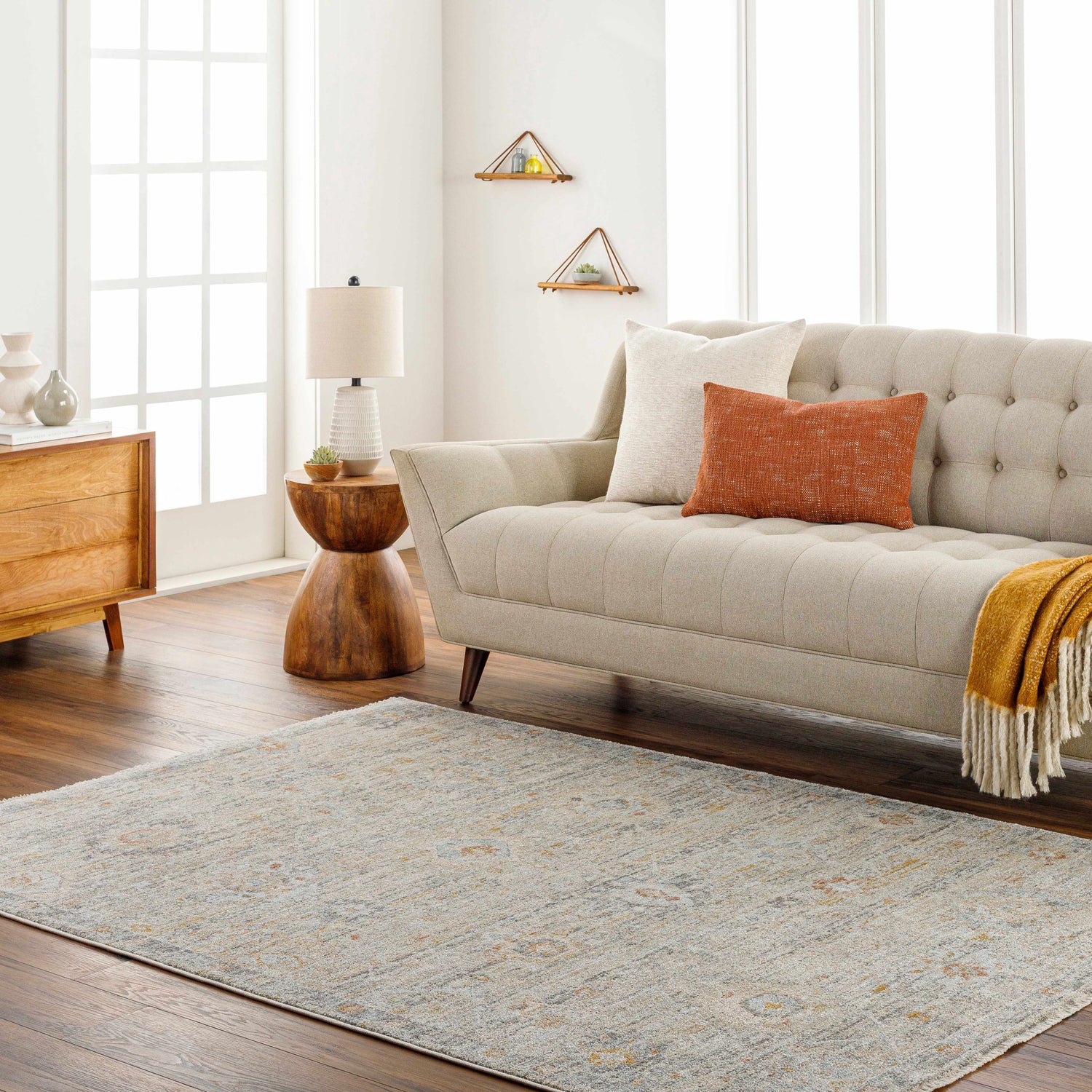 Living room scene with beige sofa and the Ayane Area Rug in dark beige and gray. Roomscene-Rectangle