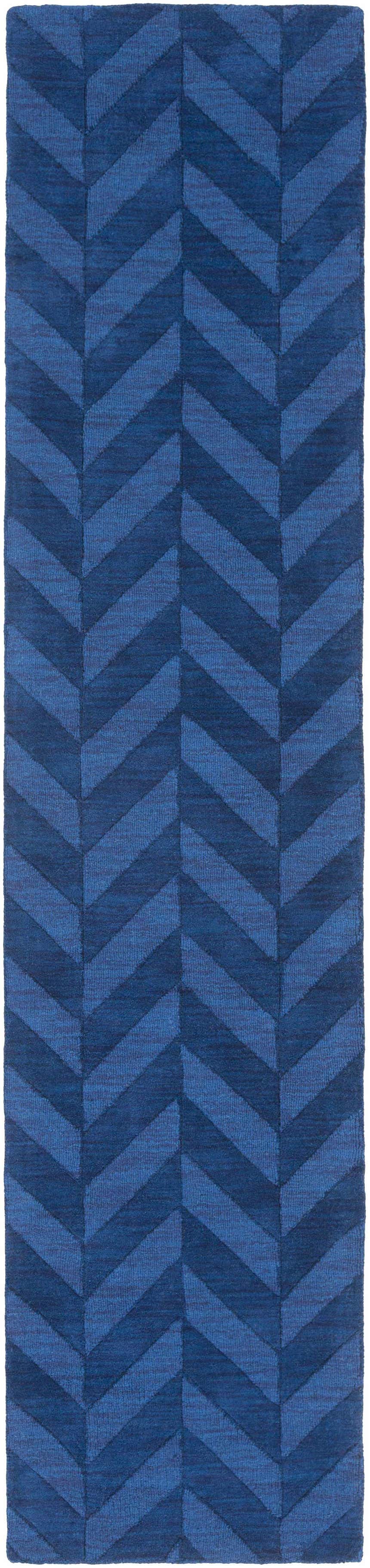 Close-up of the navy Searsmont Area Rug. Features a textured, chevron pattern in varying shades of blue. Clearance item. Design-Runner-310