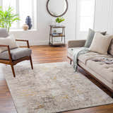 Living room scene with a beige sofa and the Yuji Area Rug in beachhouse colors. Roomscene-Rectangle