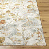 Close-up of the machine-woven Ouida Floral Rug with copper, silver, and light wood floral pattern on a natural background. Front