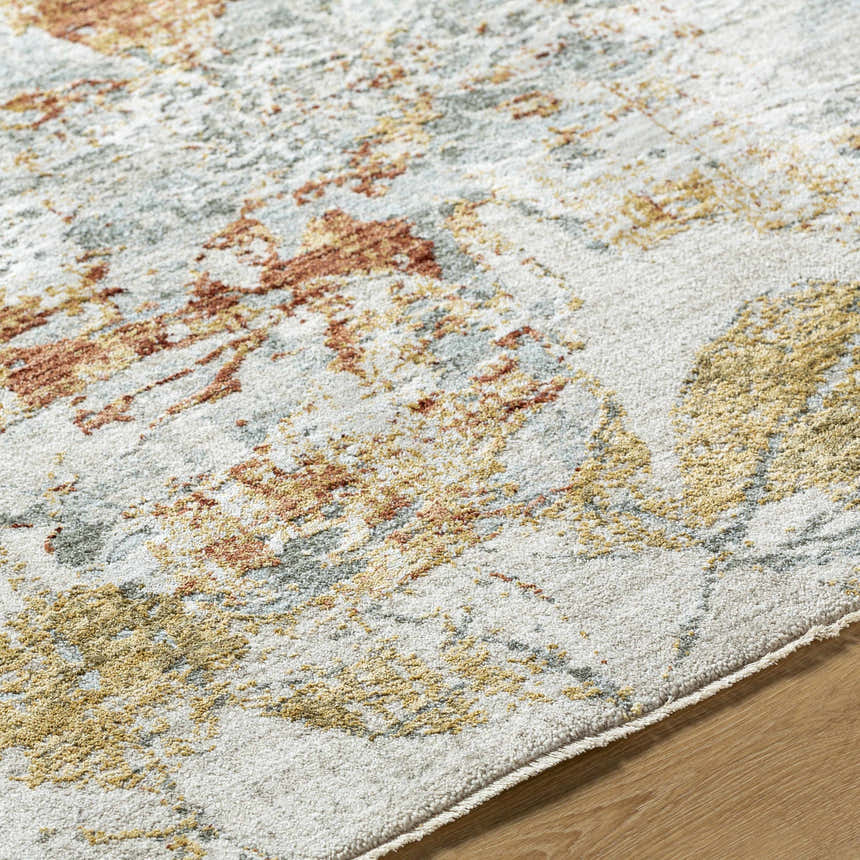 Close up of the Ouida Floral Rug showing its copper, light silver, and light wood colors and farmhouse style. Texture