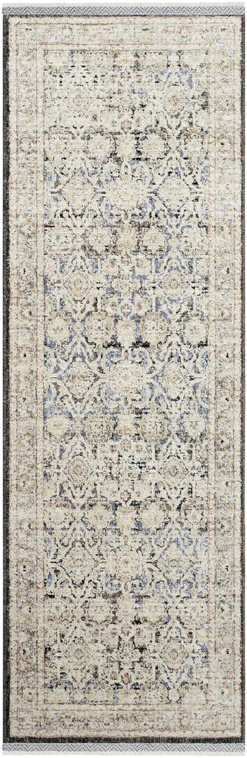 Close-up of the Harel Area Rug. Beige rug with dark brown, gray, and blue traditional pattern and texture. Design-Runner-27710