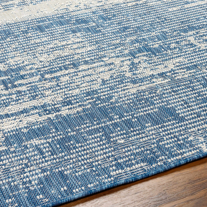 Cline Blue Area Rug - Promo
