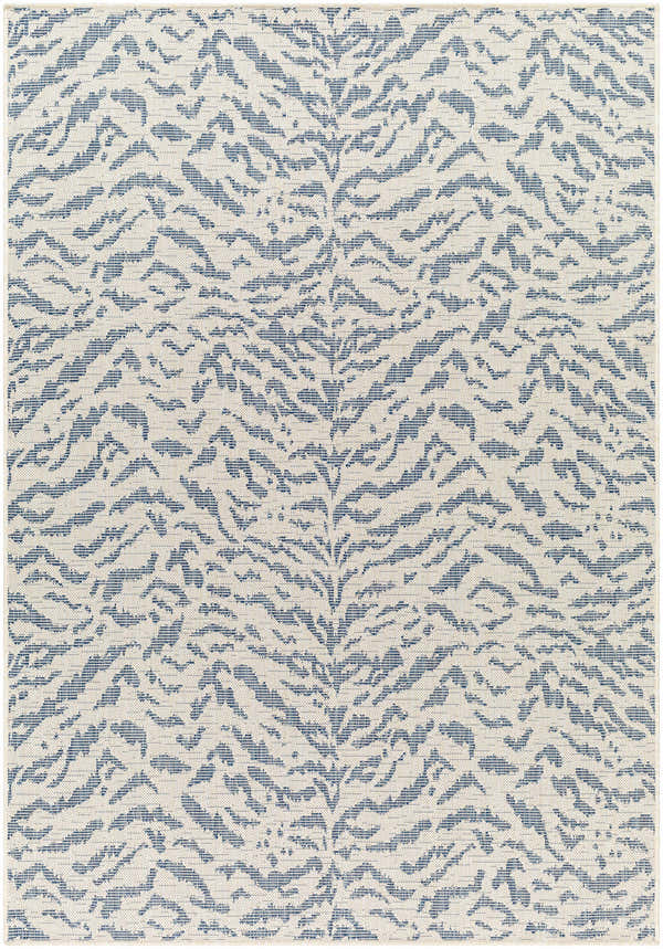 Close-up of Friso Blue Area Rug, featuring a contemporary beige backdrop with a bold, abstract blue pattern. Design-Rectangle-537