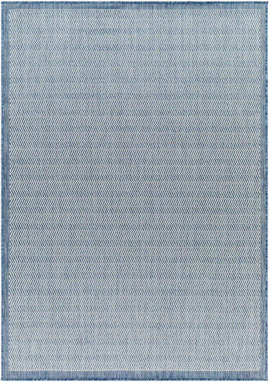 Close-up of the Genet Blue Area Rug showing a herringbone pattern in denim and arctic stone colors. Design-Rectangle-537