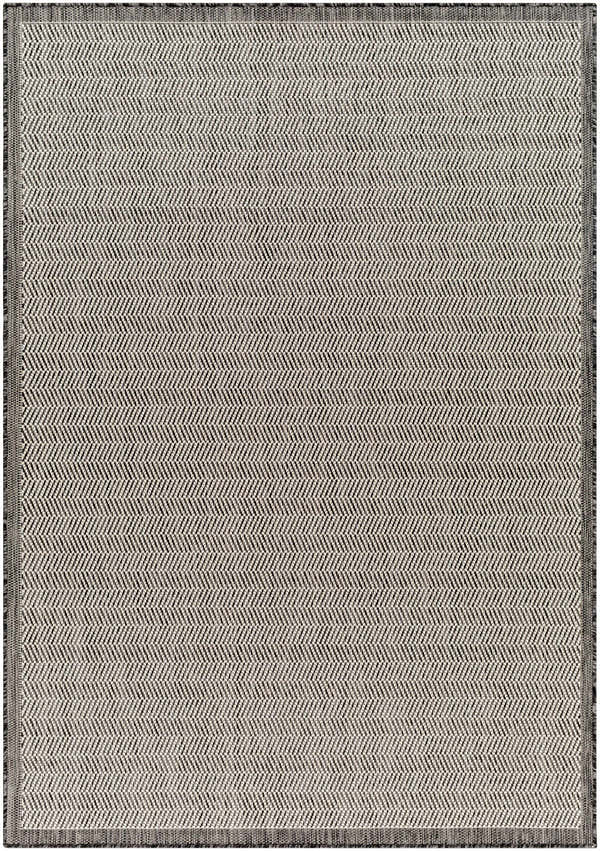 Close-up of the Genet Gray Area Rug, featuring a modern herringbone pattern in dark and light gray tones with a fringed edge. Design-Rectangle-537