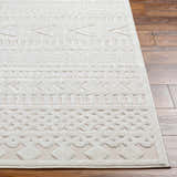 Close-up of Jove Cream Outdoor Rug showing Southwestern-style geometric pattern and soft texture on wood floor. Front