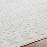 Close-up of the Jove Cream Outdoor Rug showing Southwestern-style textured patterns and neutral colors. Texture