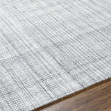Close-up of the hand woven Jezel Gray Area Rug showing its subtle farmhouse style pattern and soft texture. Texture