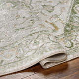 Close-up of the Gauri Green Medallion Area Rug showing its traditional design, soft texture, and farmhouse style. Fold