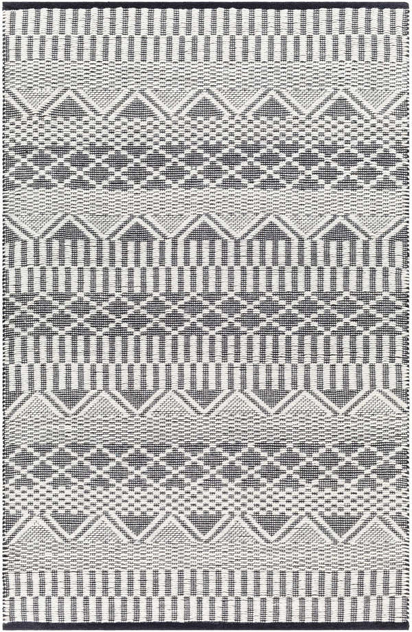 Close-up of the Carly Area Rug, a hand-woven rug with a geometric pattern in dark gray, nickel, off white, and taupe. Design-Rectangle-576