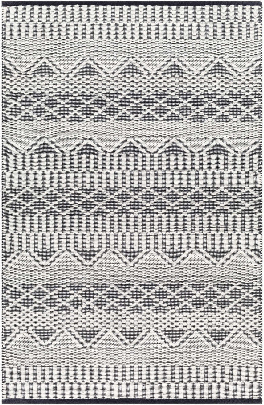 Close-up of the Carly Area Rug, a hand-woven rug with a geometric pattern in dark gray, nickel, off white, and taupe. Design-Rectangle-576