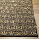 Close-up of the hand woven Irina Area Rug. Medium brown and nutmeg jute and cotton rug with a diamond pattern. Front