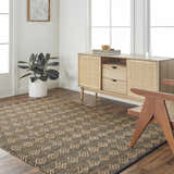 Living room scene with a brown Irina Area Rug, wood floors, and a mid-century modern cabinet. Roomscene-Rectangle