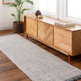 Entryway with Beige Teal Aron Area Rug runner, wood console table, plant, and wood floors. Roomscene-Runner