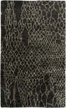 Close-up of the Stephentown Clearance Jute Rug, featuring a dark gray background and a cream-colored geometric pattern. Design-Rectangle-58