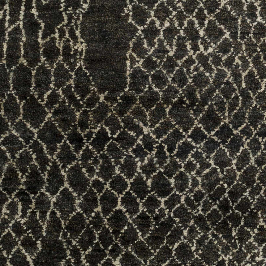 Close-up of the Stephentown Clearance Jute Rug. Hand-knotted, dark jute rug with a geometric lattice pattern. Contemporary style. Swatch