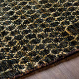 Close-up of the textured Stephentown Clearance Jute Rug. Features a contemporary black and tan geometric pattern. Texture