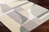 Close-up of Duru Area Rug showing contemporary beige, brown, and gray geometric pattern on a hand-tufted wool rug. Corner