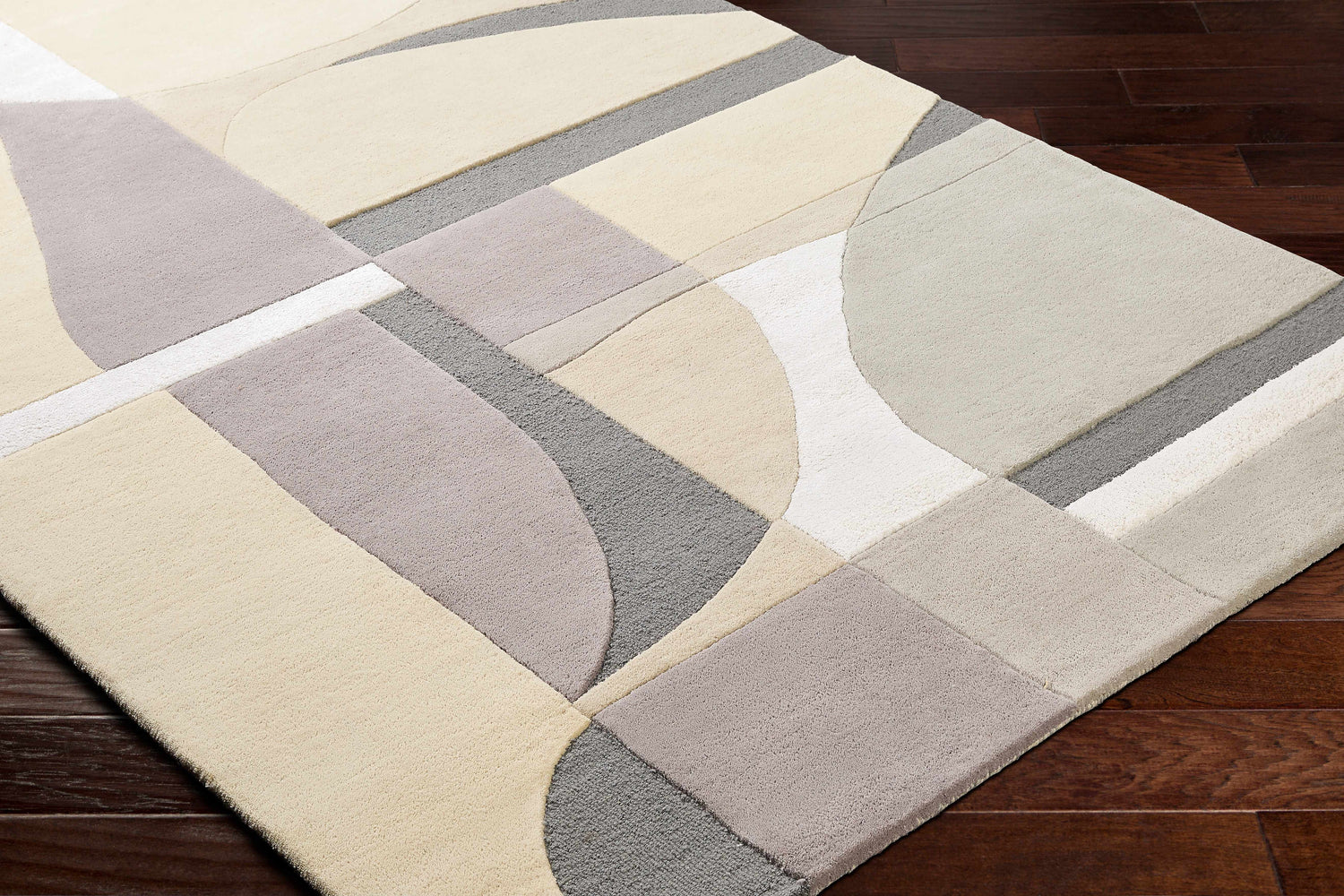 Close-up of Duru Area Rug showing contemporary beige, brown, and gray geometric pattern on a hand-tufted wool rug. Corner