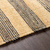 Close-up of Stapleford Striped Jute Carpet showing cream and navy stripes, and hand-woven texture on dark wood floor. Texture