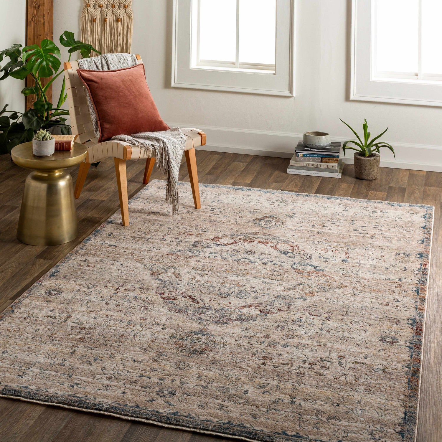 Entryway with Stratmoor Area Rug in beige, blue, and burnt orange. Traditional style with chair, side table, and plants. Roomscene-Rectangle
