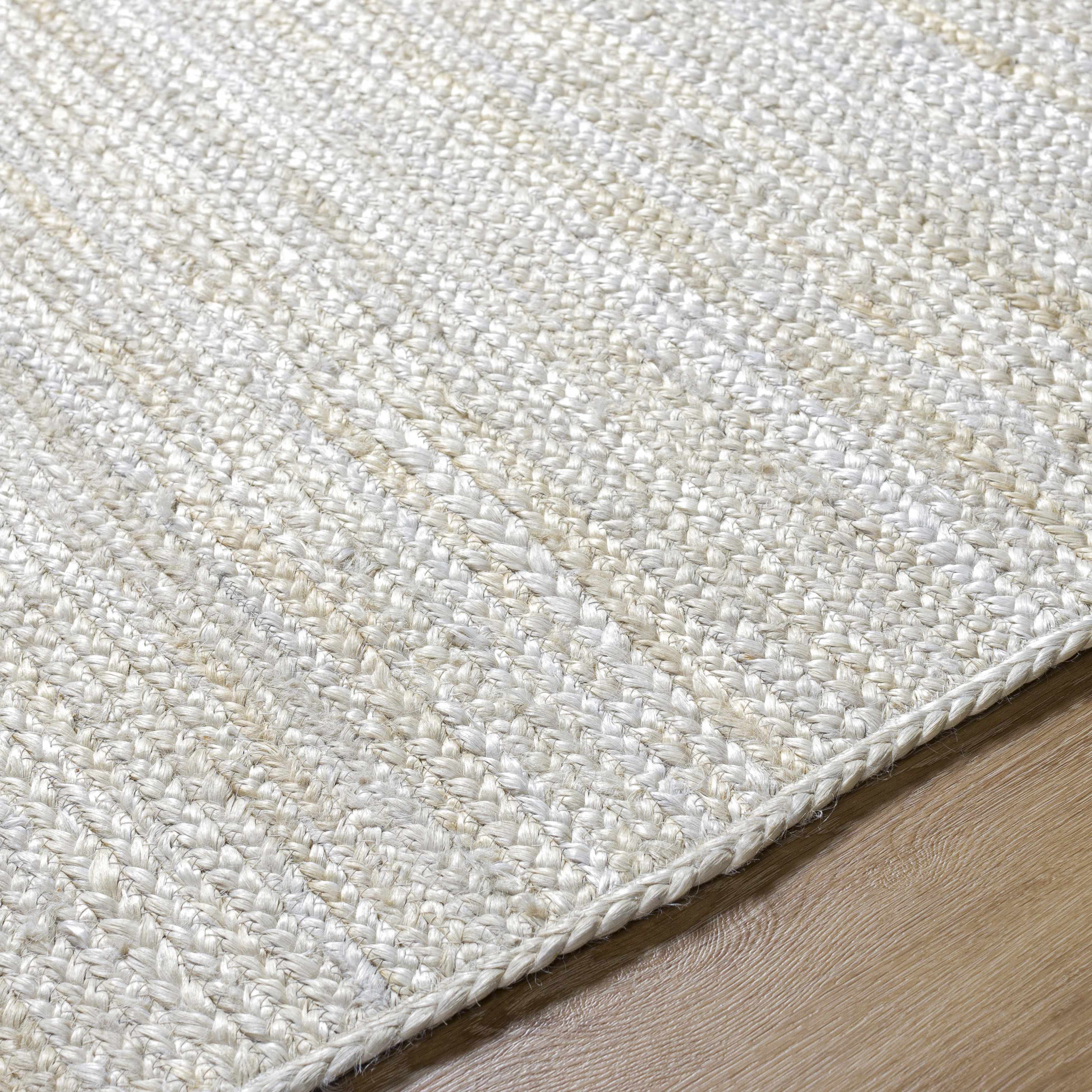 Close-up of the texture on Adahy Area Rug, showing fabric weave and feel. Contemporary Area Rug Backing  