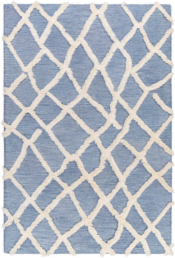 Close-up of the Adica Blue Wool Area Rug, featuring a raised ivory trellis pattern on a denim blue, hand-tufted wool base. Design-Rectangle-576
